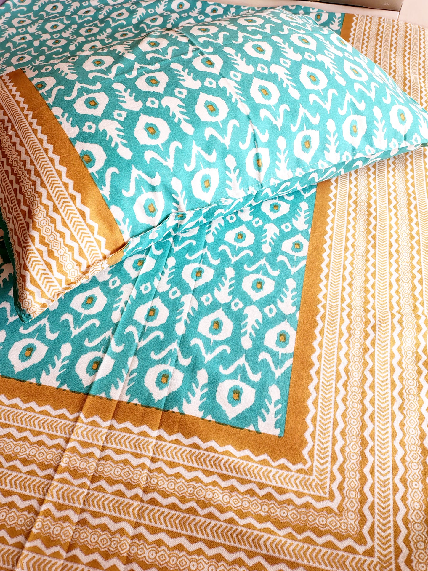 Sea Green Ikkat Traditional Printed Bedsheet with Two Reversible Pillow Covers